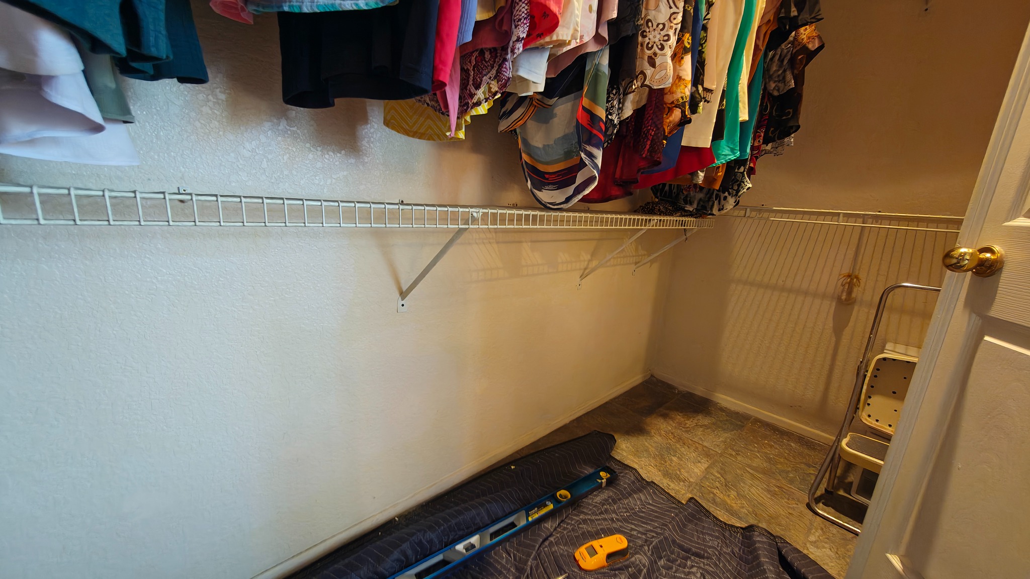 Master closet wire shelving restored and leveled after repair