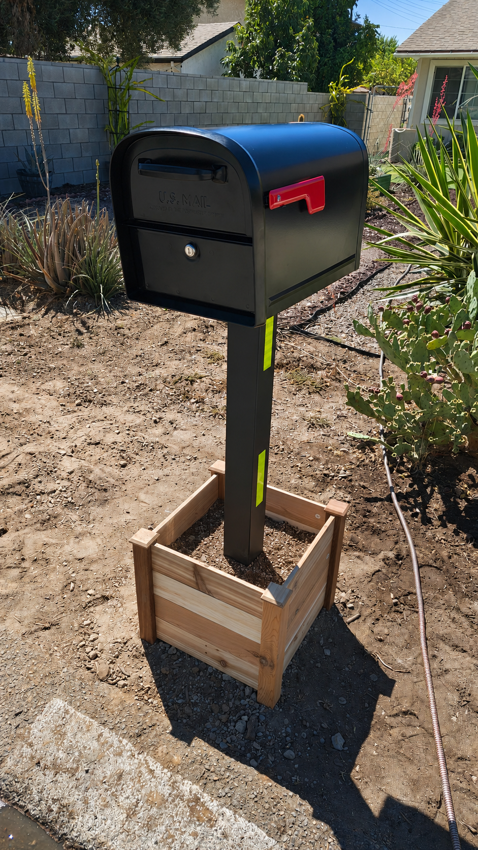 Side view of completed mailbox, post, and planter surround