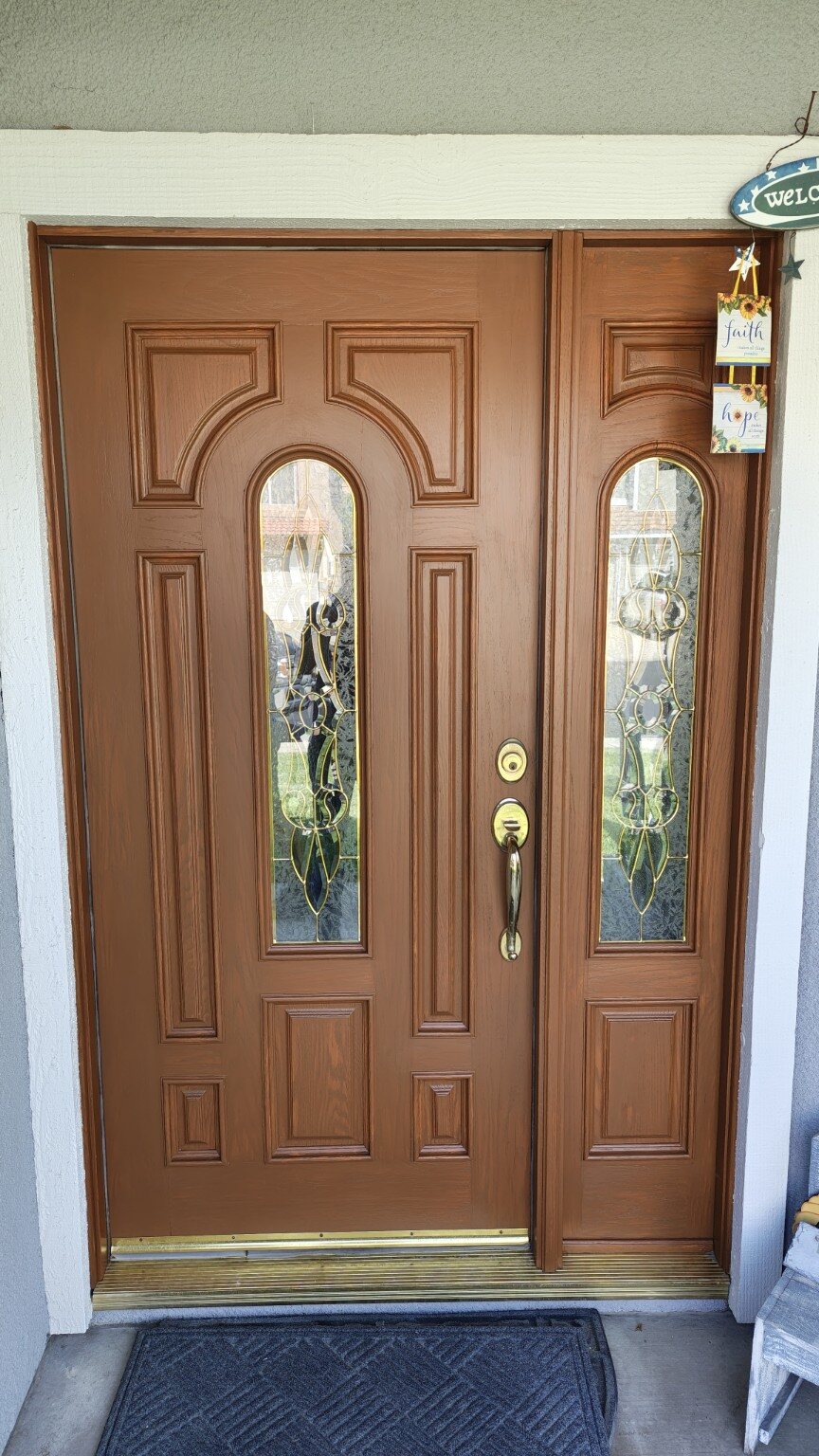 Oak entry door after cleaning, refinishing, and weather protection