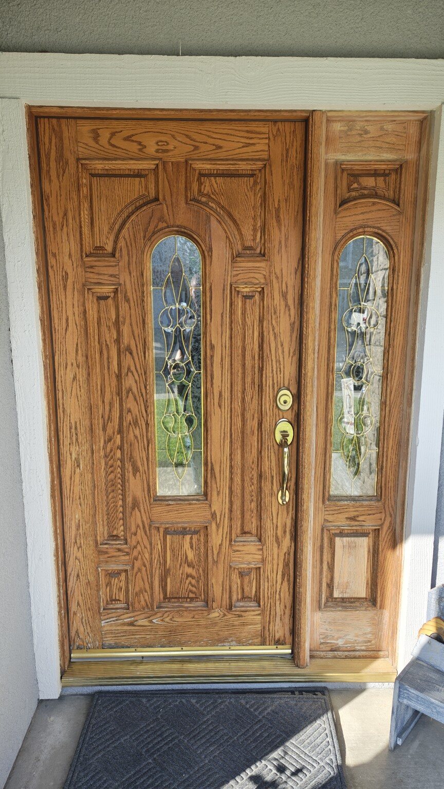 Oak entry door before restoration with a weathered finish