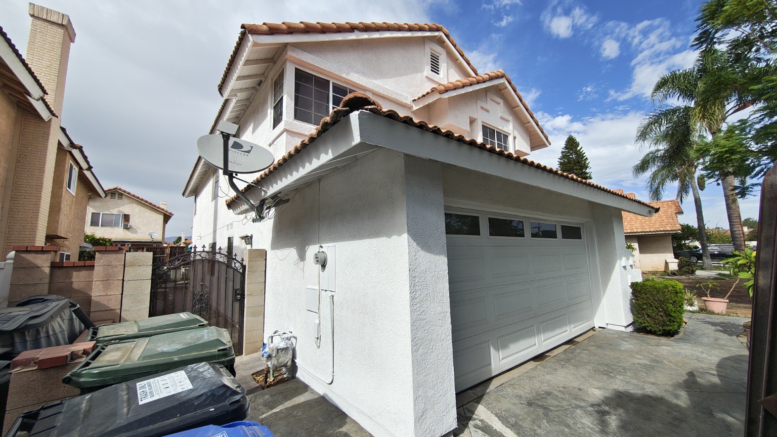 Freshly painted home exterior with contrasting trim — view 3