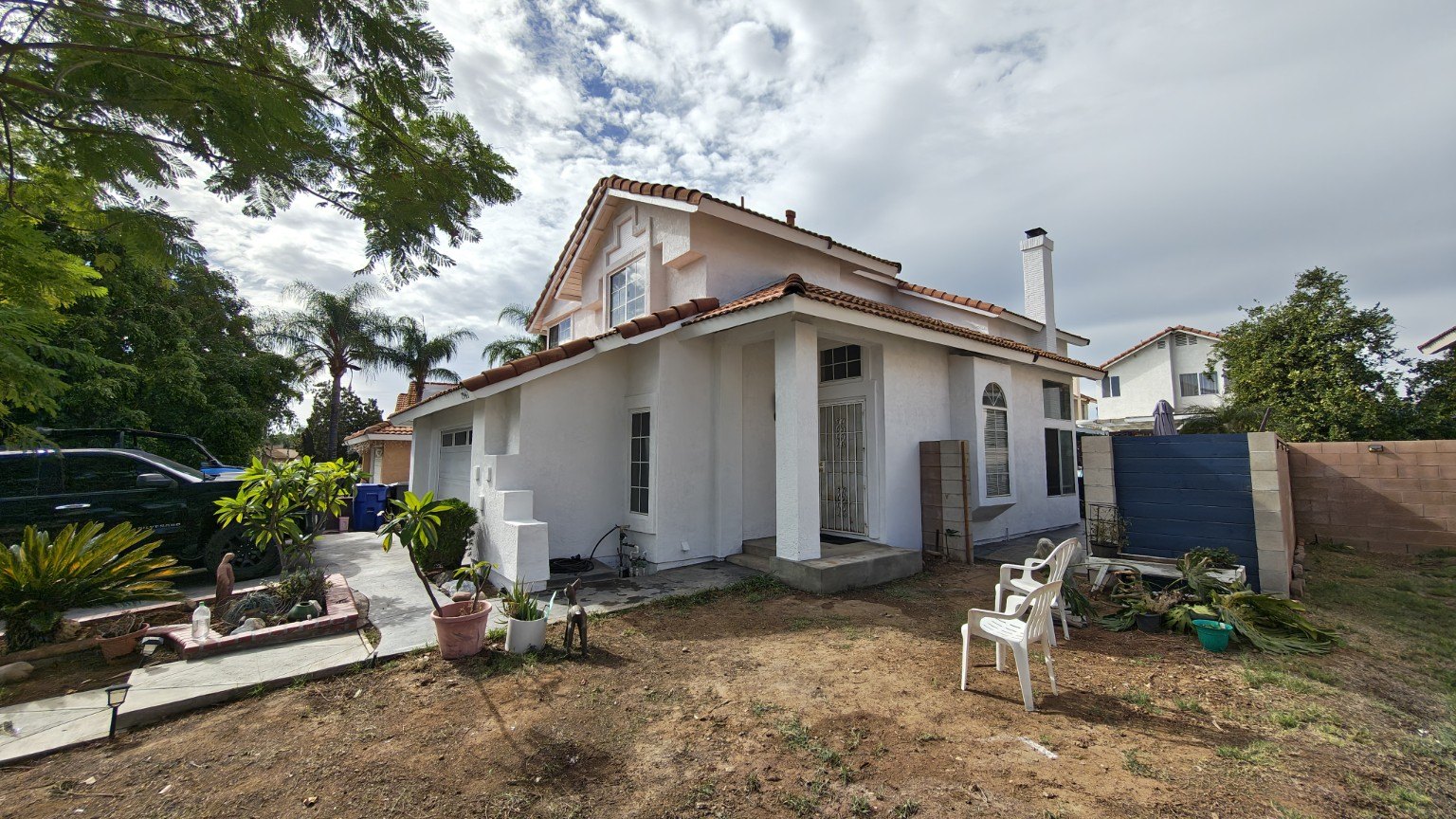 Freshly painted home exterior with contrasting trim — view 4