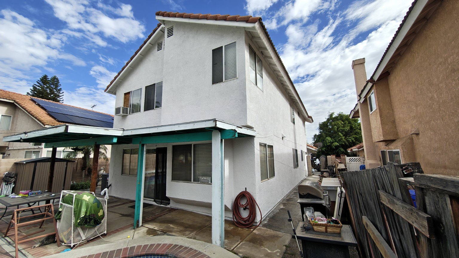 Freshly painted home exterior with contrasting trim — view 5