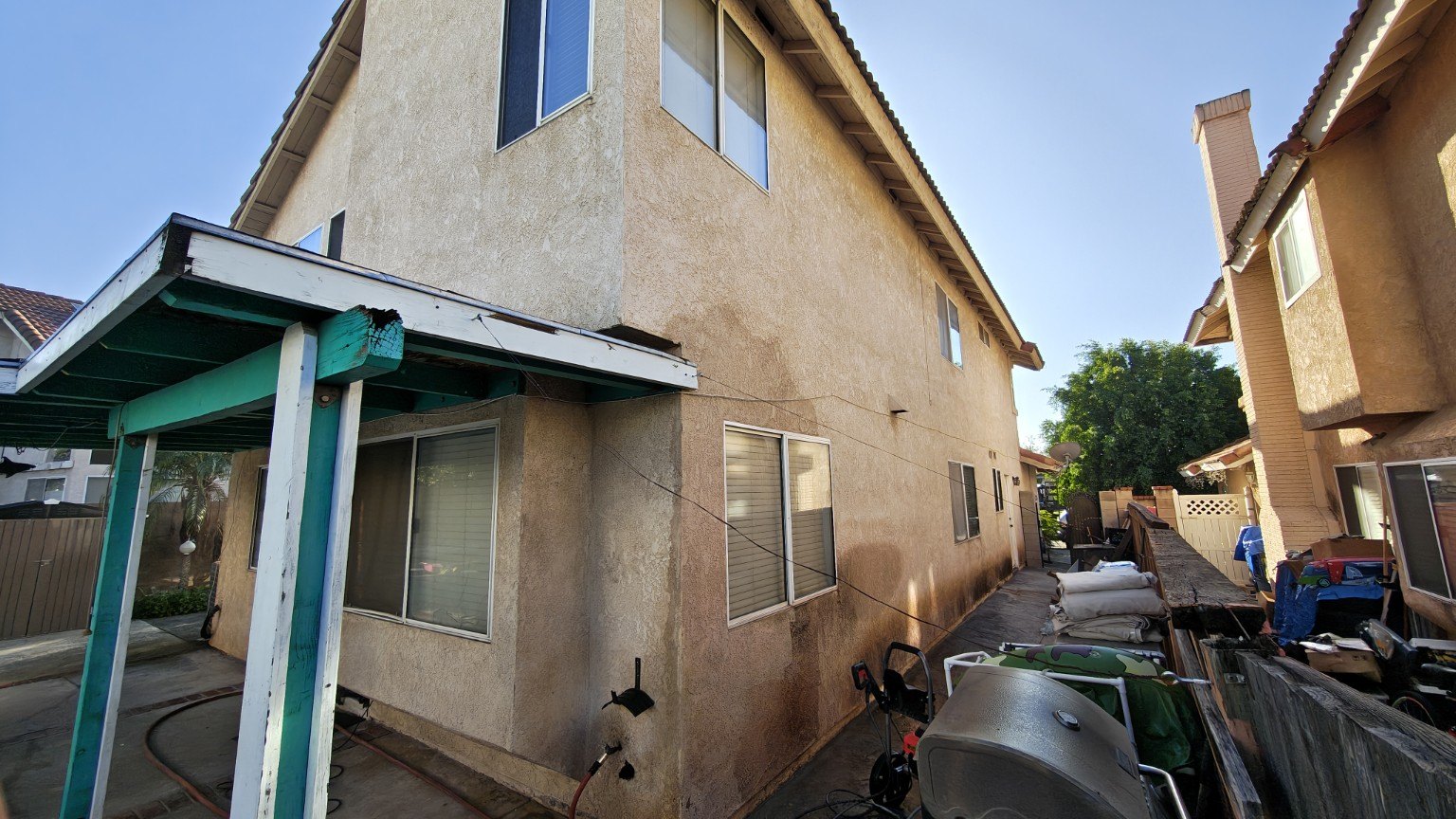 Weathered exterior before painting — view 2