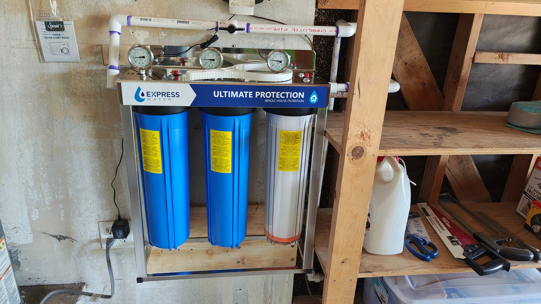 Close view of three-stage whole-home water filtration system