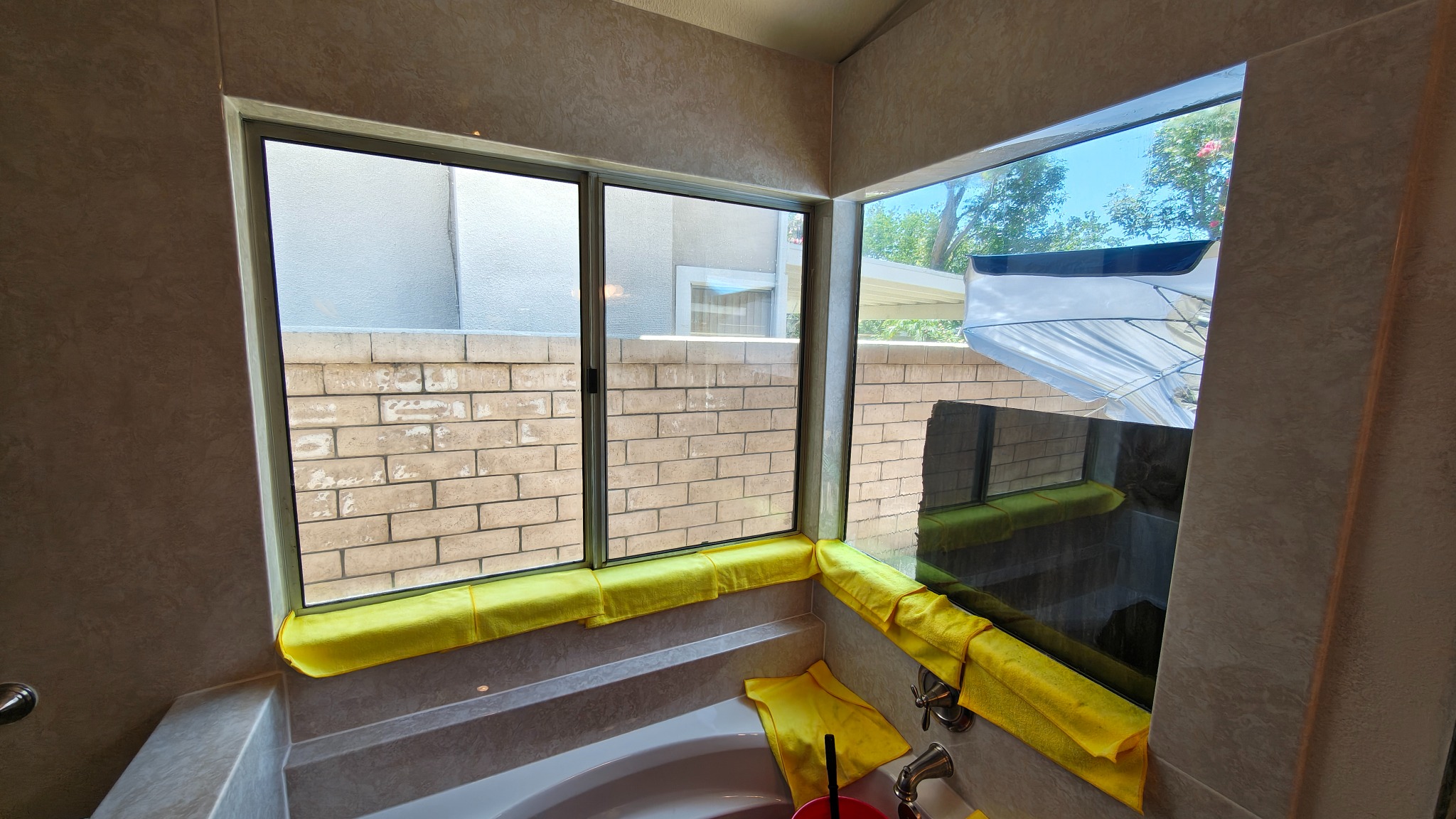 Master bathroom windows before privacy film installation